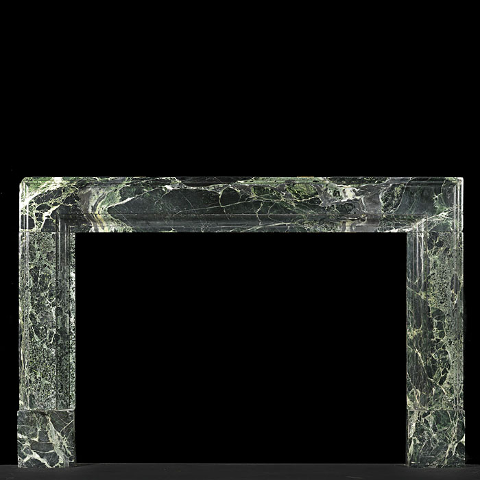 A Verdi Tinos Green Marble Art Deco Bolection fireplace
