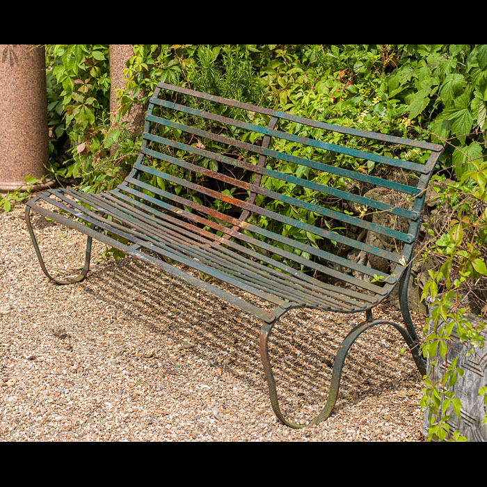 A Victorian wrought iron garden bench

