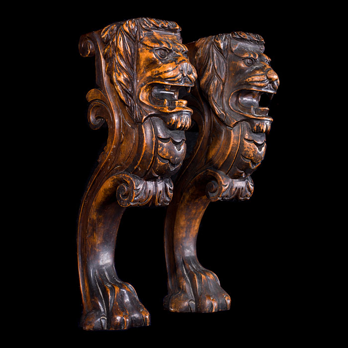 A pair of lion walnut monopodia terms
