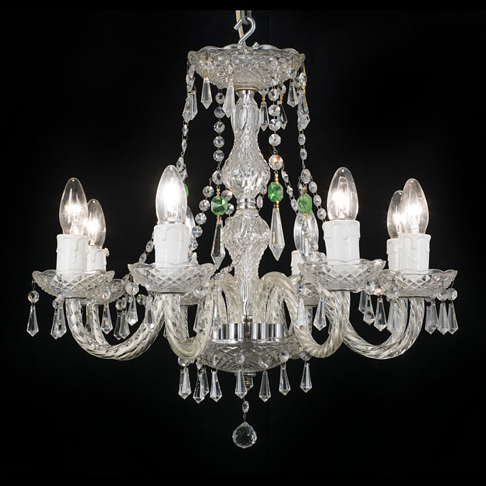 An eight branch 20th century cut and moulded glass chandelier    