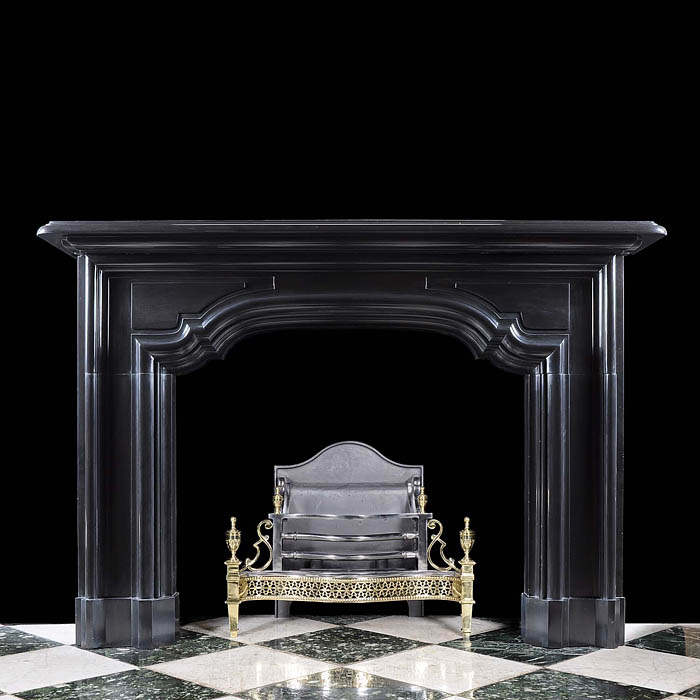 A large antique Belgian Black Marble Baroque Style Chimneypiece Mantel