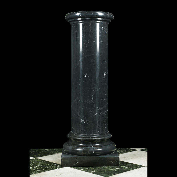 A 20th century black marble column