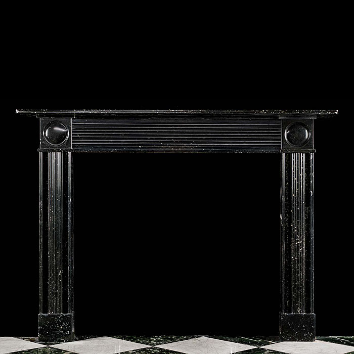 A Regency Black Fossil Marble Fireplace