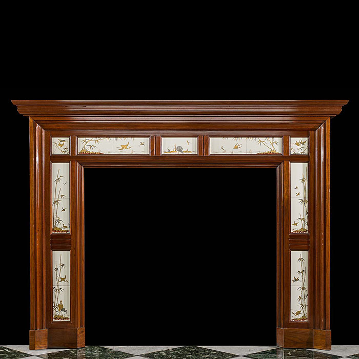 A Victorian antique chimneypiece in walnut set with rare Minton Tiles