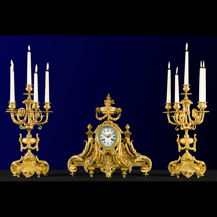 A  Gilt Bronze Rococo Style Clock Garniture