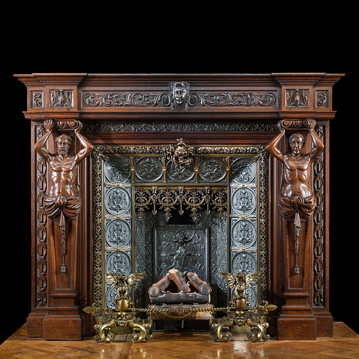 A large French carved Oak Renaissance style fireplace and insert.