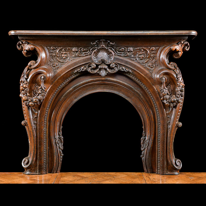 A Cast Iron Rococo Style Fireplace Surround