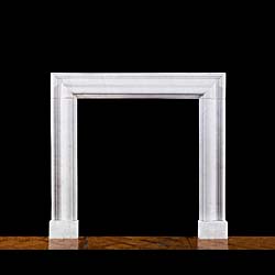 A Carrara Marble bolection fire surround
