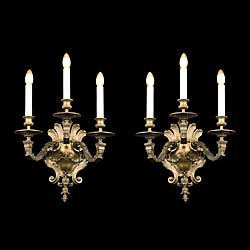 A pair of large Baroque style wall lights