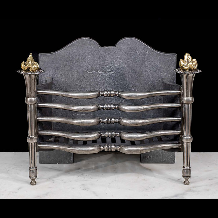 A Regency style brass and iron fire basket