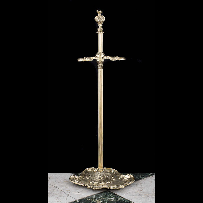 A Rococo style ornate brass firetool stand