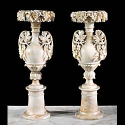 A tall pair of alabaster urns 