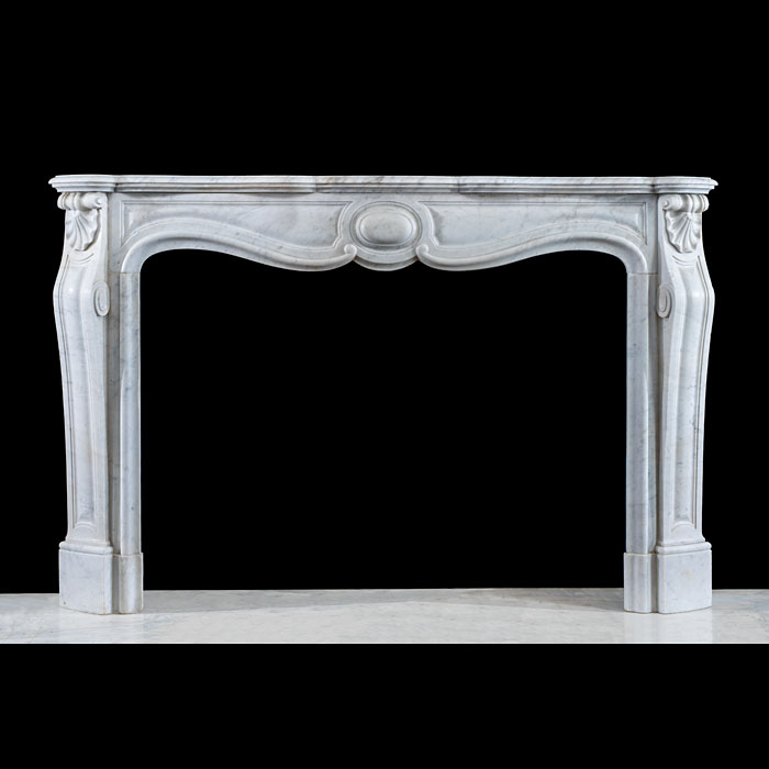 A Large Carrara Marble Louis XV Chimneypiece