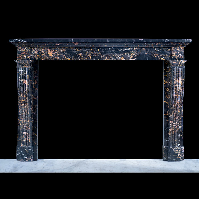 A Simple French Louis XVI Style Portoro Marble fireplace
