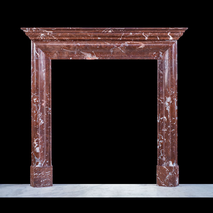 A Small Rouge Royale Marble Bolection Chimneypiece