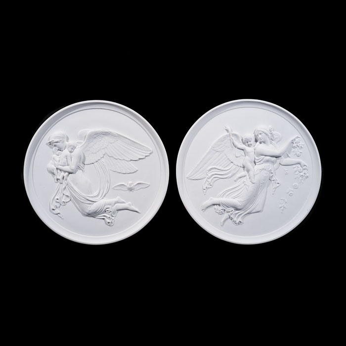 Pair of Large Biscuit Porcelain 'Night and Day' Reliefs 