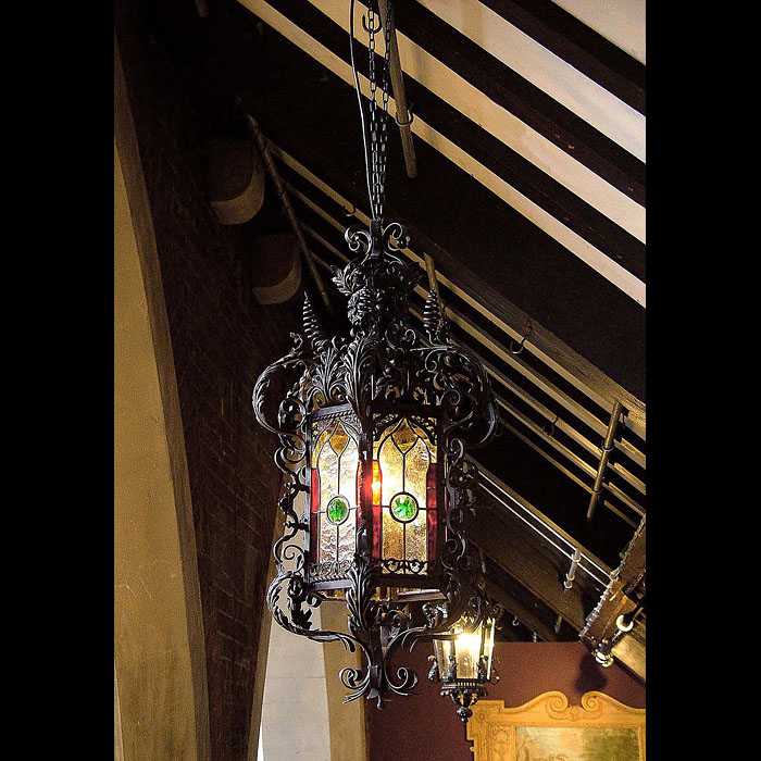 A Victorian wrought iron antique porch lantern in the Venetian manner   